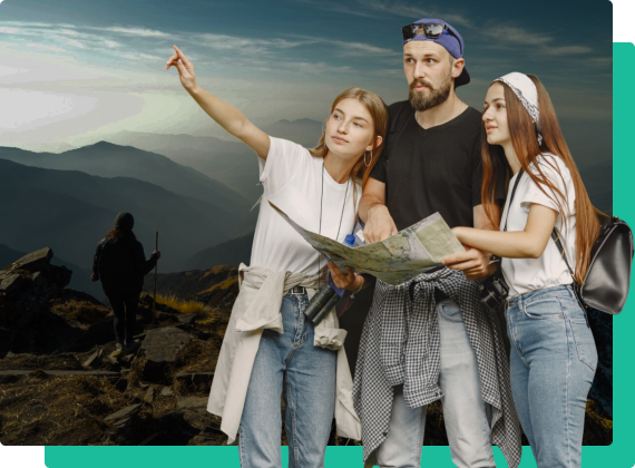 Group of friends on a mountain looking at a map